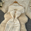 Luxury chic women's french-style one-shoulder bandeau dress with metal buckle, cinched waist, and flowing ribbon mesh detail