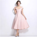 Elegant women's evening gown: high-end off-the-shoulder camisole dress with diamond embellishments, cinched waist, pleated detailing, and a flowing a-line skirt