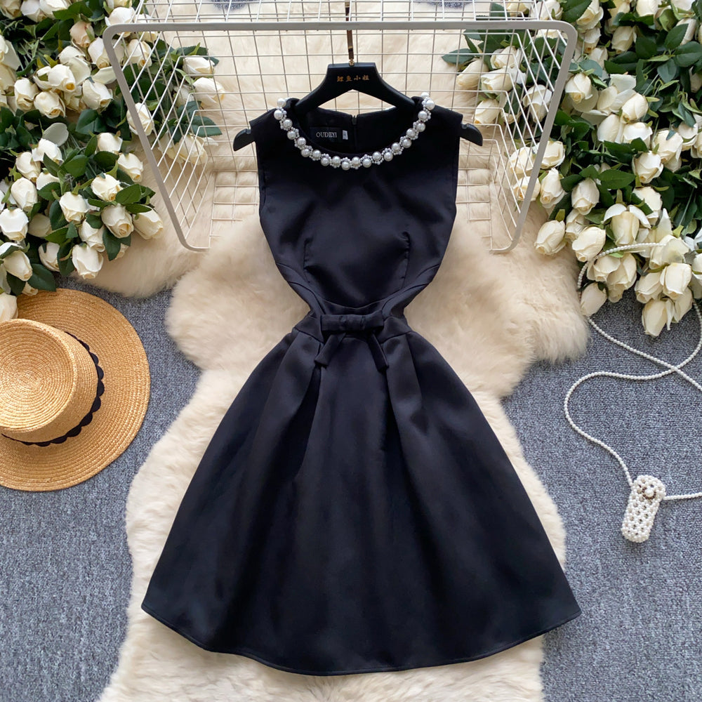 High-end, understated luxury beaded round neck sleeveless dress for women. perfect for summer, this french-inspired dress features a cinched waist, a-line silhouette, and a flattering, voluminous skirt. ideal as an elegant evening gown or special occasion