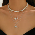 Wholesale diamond-studded mermaid tail bow pendant necklace - european & american cross-border, light luxury, high-end style - women's layering necklace with faux pearl accents