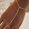 Exquisite new gold-tone chain and trendy ring stainless steel bracelet for women, designed with a chic and individualistic flair