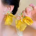 Vacation-style yellow floral fabric earrings for women, beachy colorful face-framing small earrings, statement earrings, unique and eye-catching ear accessories