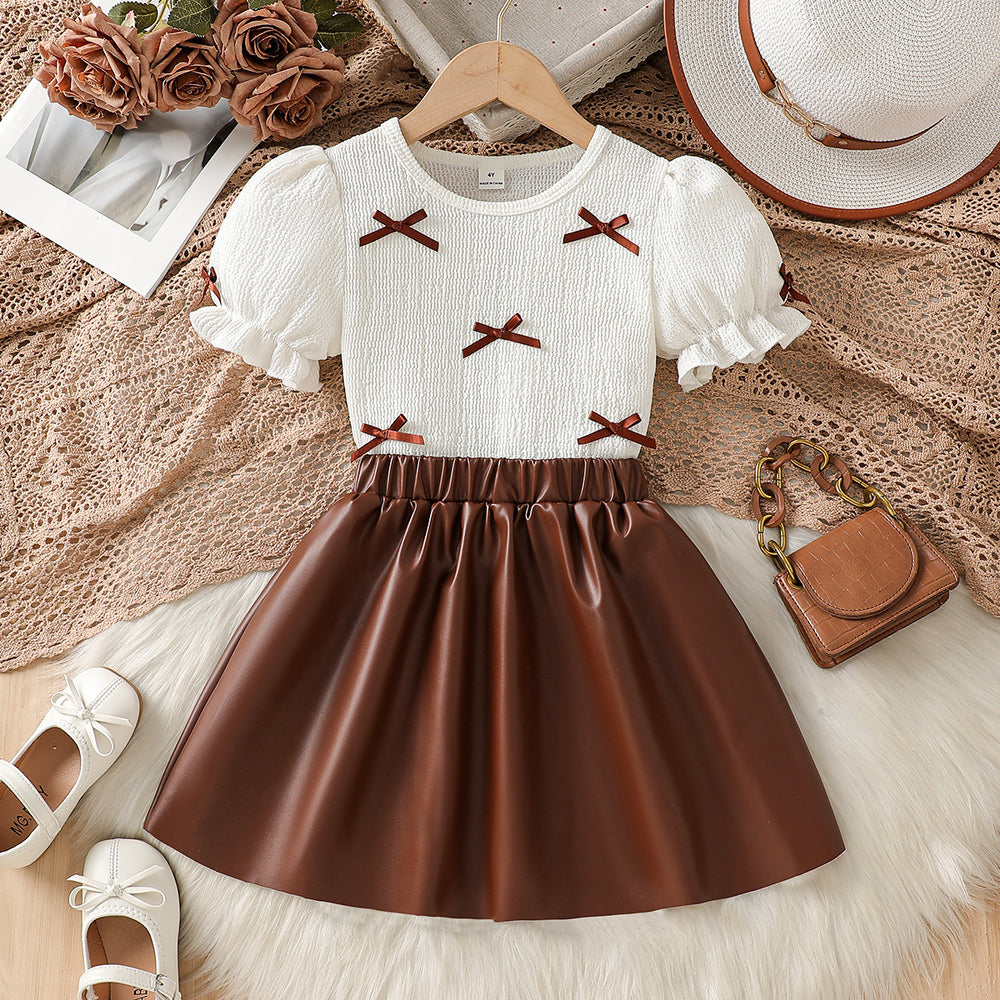 girls' autumn new arrival: bubble sleeve bow texture top + pu leather a-line skirt two-piece set