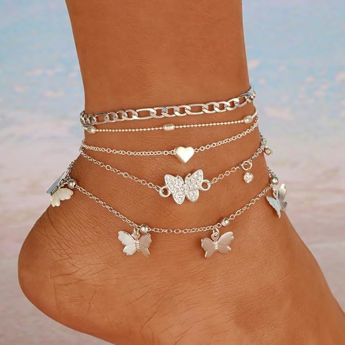 "instagram-worthy, understated luxury anklet set featuring butterfly, shell, and seed beads. available in gold and white gold."