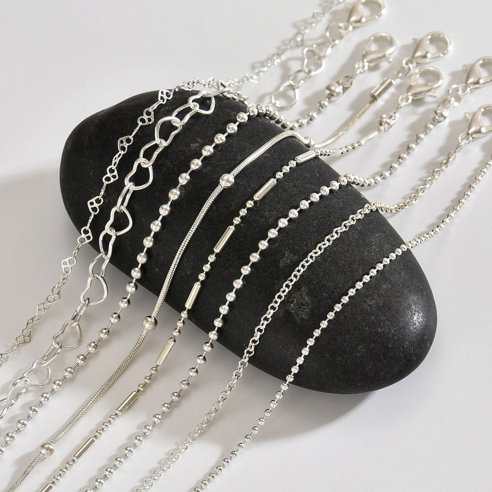 European and american cross-border jewelry: trendy & stylish alloy bracelet set for women - heart, round bead, and irregular bead designs - wholesale