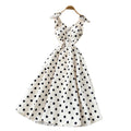 French high-end women's dress - autumn  collection: elegant bow-embellished camisole dress with cinched waist, flared hem, and polka dot detail - a flattering, flowy maxi dress