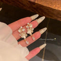 French-style cubic zirconia flower tassel earrings - women's luxury, high-end, and exquisite stud earrings. ethereal, trendy, and chic