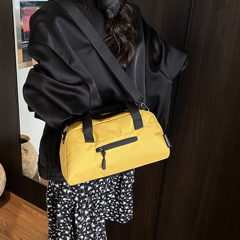 Cross-border women's lightweight handbags, large-capacity business travel bags, luggage bags, sports fitness bags, shoulder messenger bags.