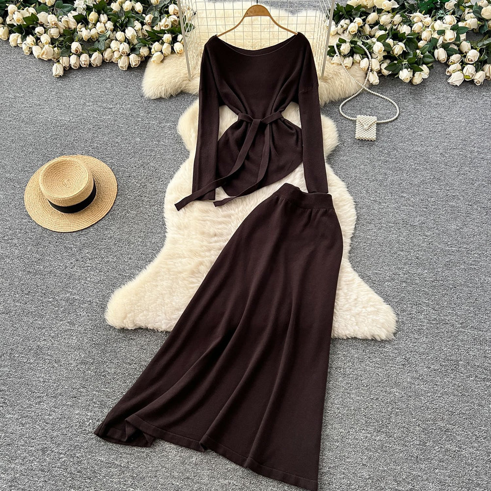 French chic autumn/winter outfit: asymmetrical tie-waist long sleeve knit top + high-waisted midi skirt