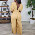 C8592  foreign trade  new european and american cross-border fashion v-neck high-waisted solid color sexy pleated jumpsuit