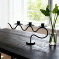 European retro minimalist wavy iron candle holder with electronic candles for a romantic ambiance in living room or dining table