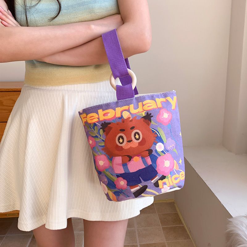 Cute cartoon canvas tote bag for women, 2024 new style handheld bucket bag, large capacity lunch bag, fashionable cloth handbag