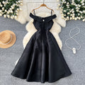 Elegant women's evening gown: high-end off-the-shoulder camisole dress with diamond embellishments, cinched waist, pleated detailing, and a flowing a-line skirt