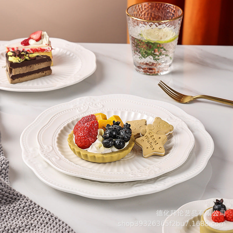 European-style pure white dessert plate, three-tier fruit platter, modern showroom display, creative embossed ceramic plate wholesale