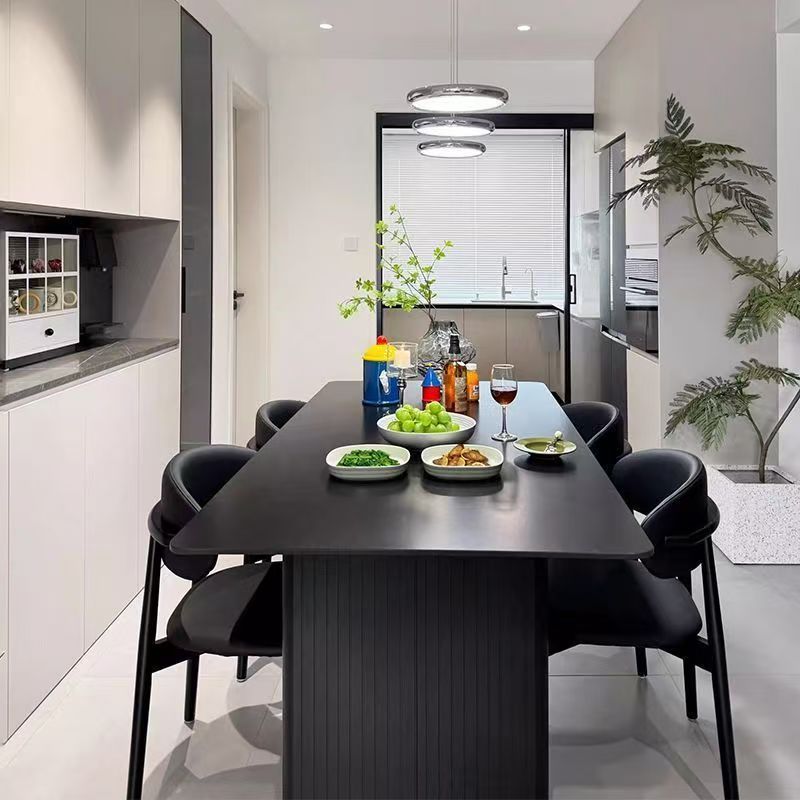 Modern minimalist sintered stone dining table with black dining chairs set - premium small apartment italian-style rectangular dining table for home and b&b
