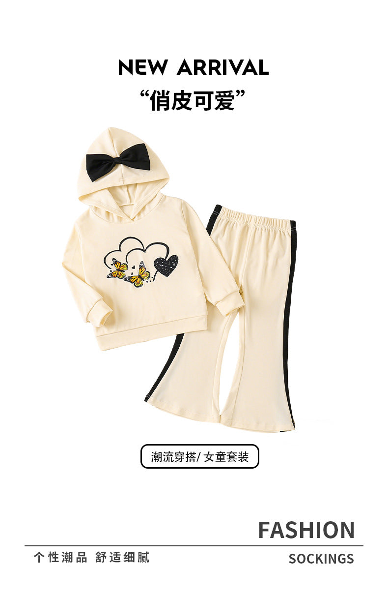 Girls' autumn outfit: beige hooded sweatshirt with cartoon print and bow detail, paired with flared pants