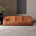 Minimalist mid-century modern genuine leather sofa for living room, homestay, designer american retro oil wax leather caramel color wavy sofa