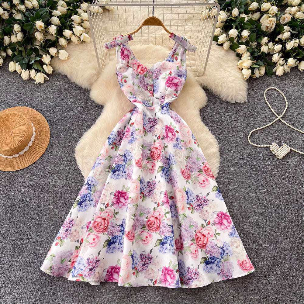 High-end floral print sleeveless dress for women, perfect for summer. elegant, high-waisted, and figure-flattering a-line silhouette, ideal for a sophisticated vacation look