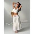 Women's embroidered v-neck sleeveless top and high-waisted a-line maxi skirt two-piece set, perfect for a stylish vacation look