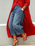 European and american style women's washed denim jeans with beaded side detailing, pearl embellished hem, vintage high-waisted wide leg jeans