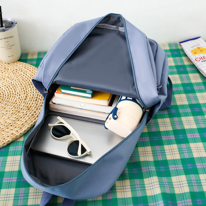 Primary and secondary school students schoolbag large-capacity bag simple solid color versatile backpack new fashion trend backpack