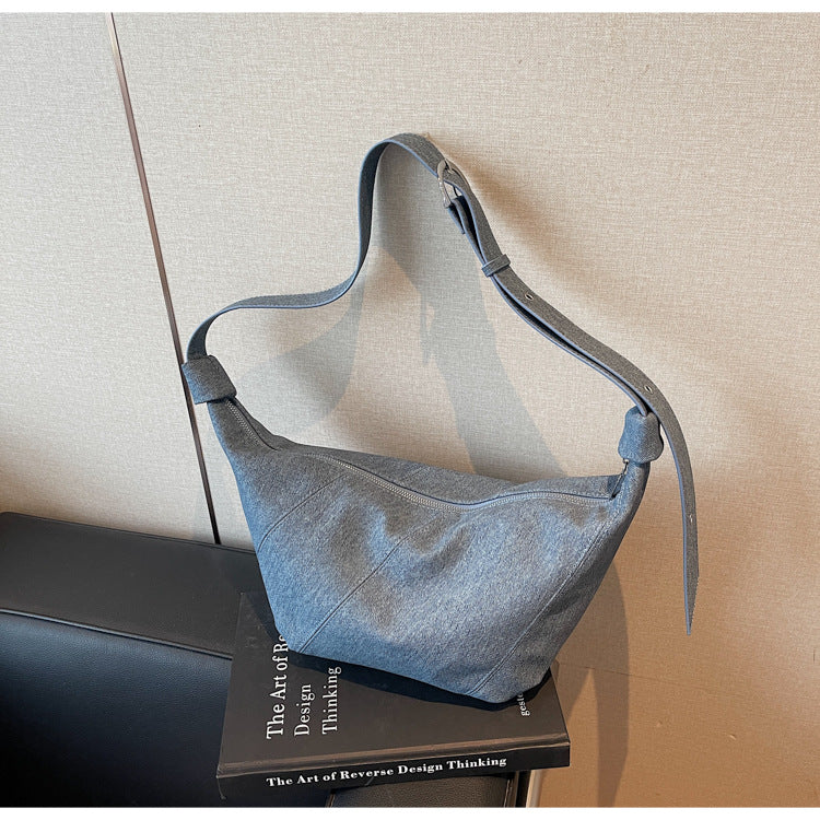 Cross-border solid color dumpling bag 2025 new Korean version fashionable simple shoulder bag niche temperament commuter messenger bag