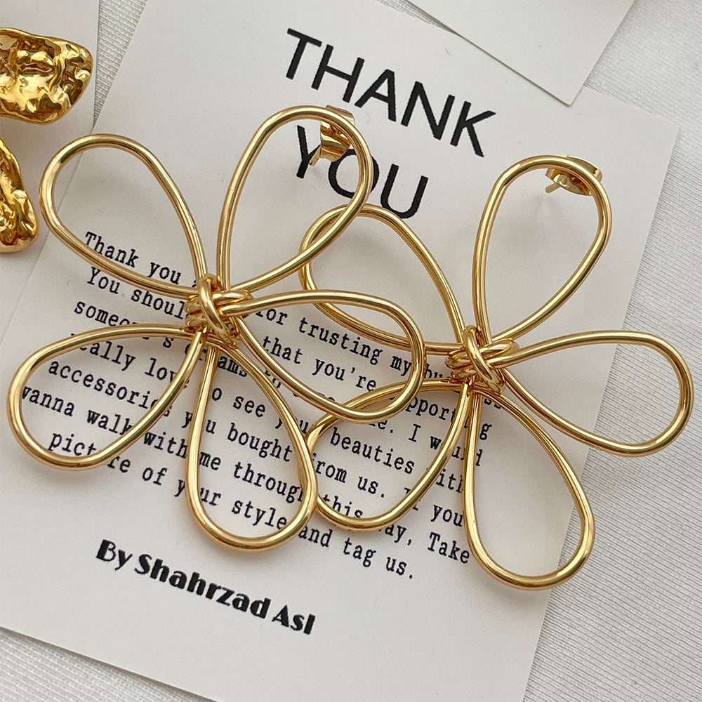 Flower earrings wholesale cross-border exaggerated sense of design earrings women's electroplated alloy versatile cut out line braided earrings