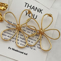 Flower earrings wholesale cross-border exaggerated sense of design earrings women's electroplated alloy versatile cut out line braided earrings