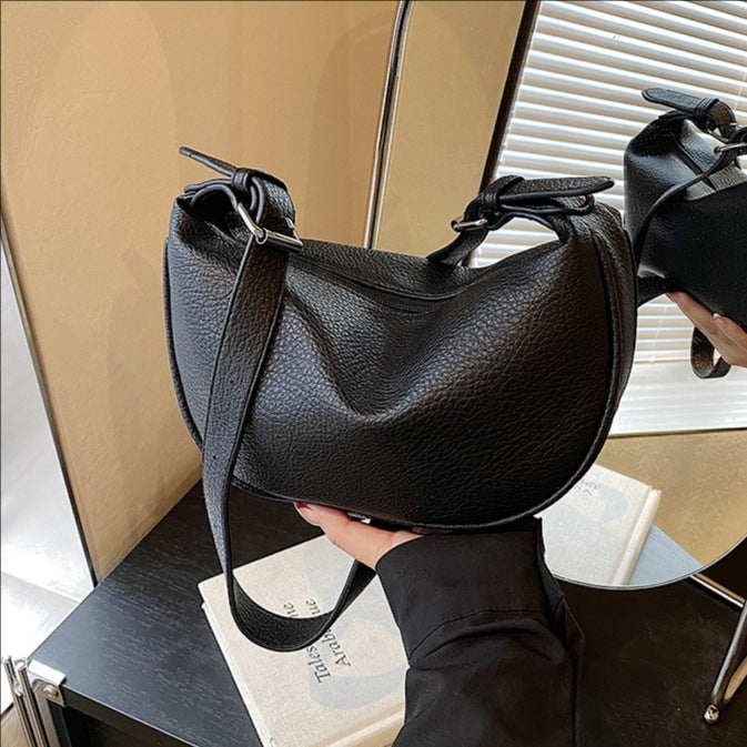 Cross-border niche soft leather lychee pattern portable dumpling bag women's 2025 new high-end fashion shoulder messenger bag
