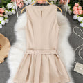 Women's sleeveless pleated mini dress with cinched waist, round neck, and belt – a chic and versatile work-ready style