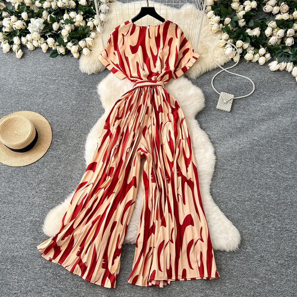 Fashion ins style vacation beach pants women's new style light mature niche stylev neck short sleeve strap looseprinting jumpsuit
