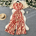 Fashion ins style vacation beach pants women's new style light mature niche stylev neck short sleeve strap looseprinting jumpsuit