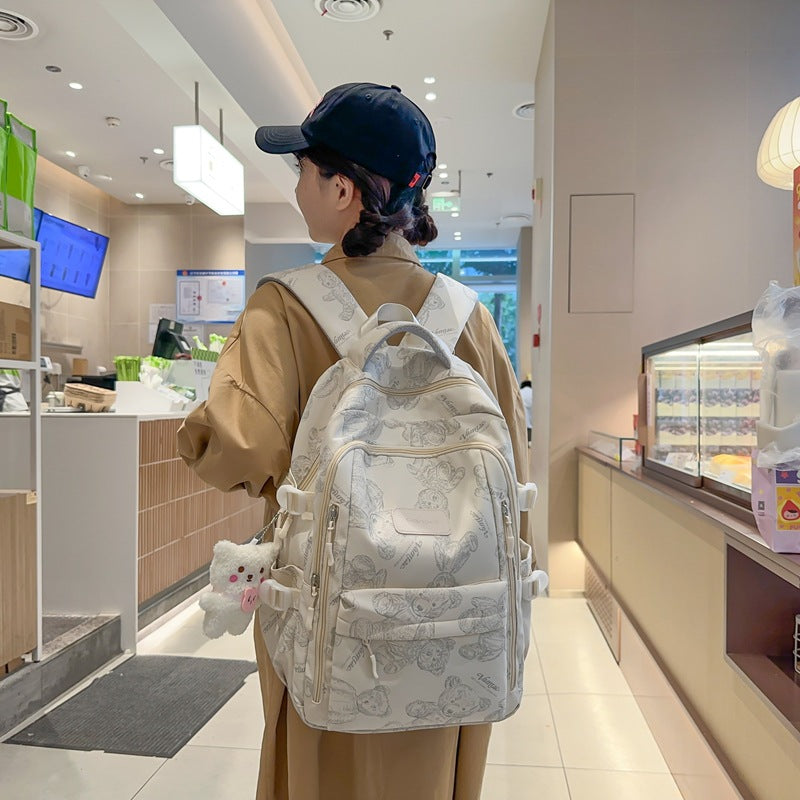 New high school and junior high school students large-capacity night reflective backpack travel backpack Japanese simple graffiti bear