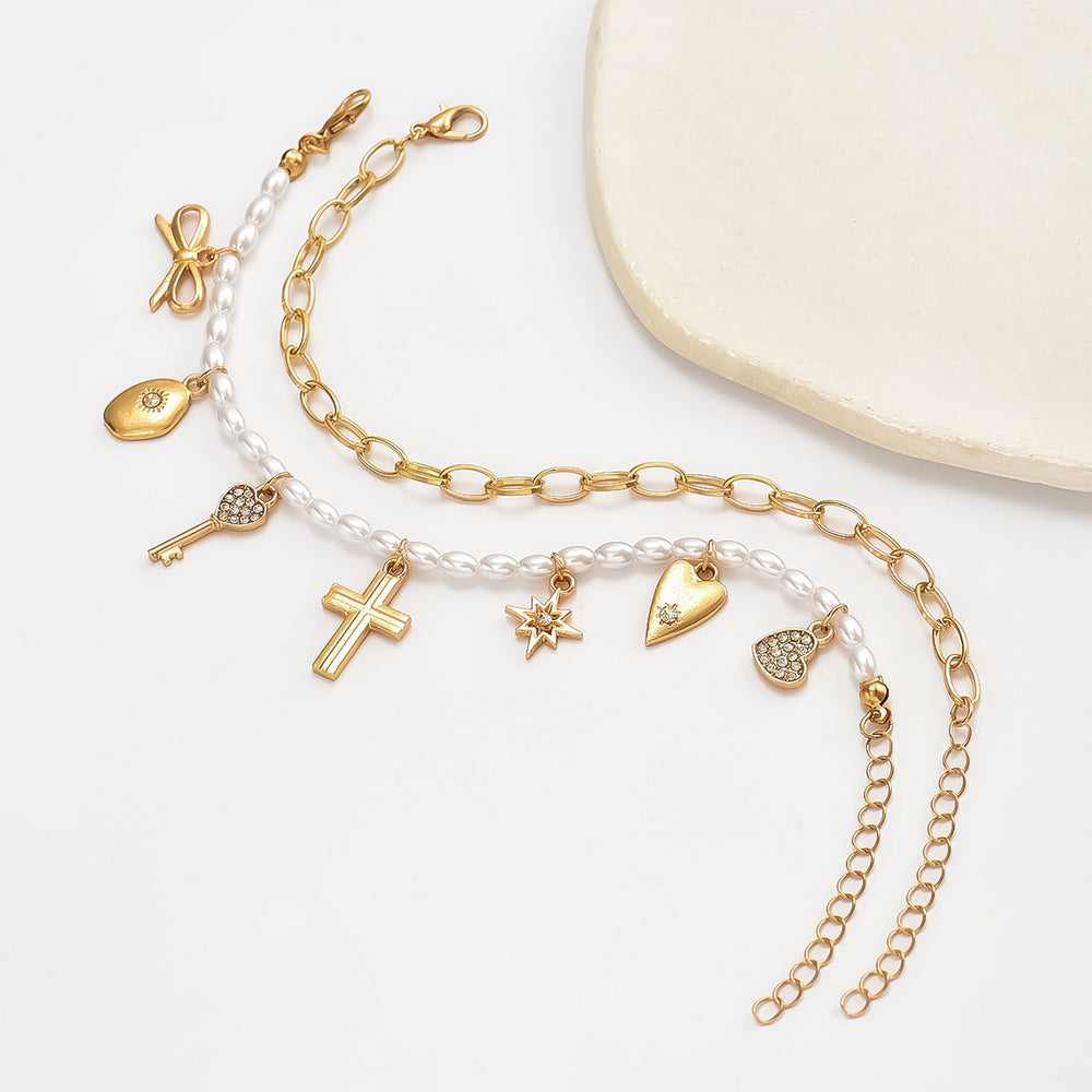 Wholesale faux pearl bracelets - european & american style, stackable, designer jewelry with cross, heart, bow, and star charms