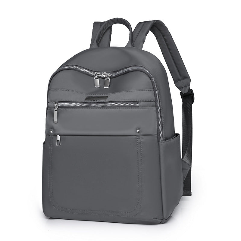 Solid color fashion casual versatile backpack simple trend lightweight business women's computer bag wholesale student schoolbag