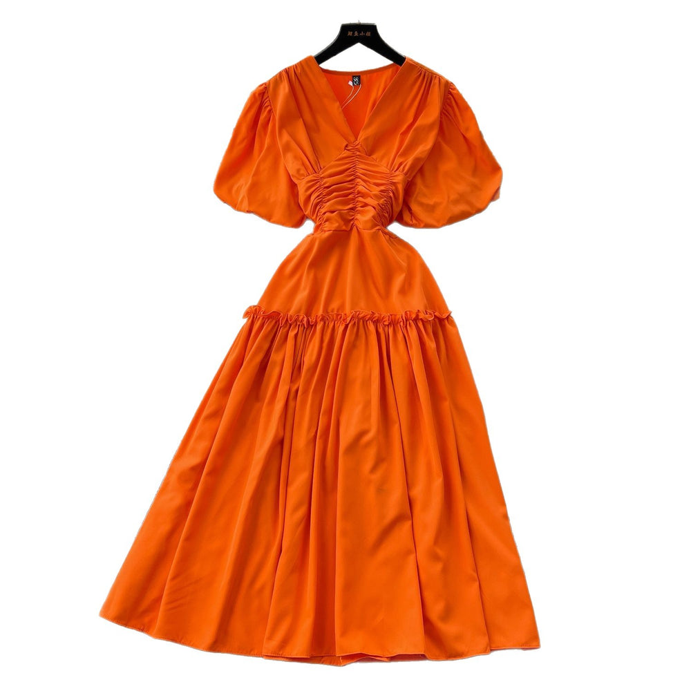 French-inspired, niche v-neck dress with ruched waist, puff sleeves, and a flowy, a-line silhouette. perfect for a slimming and elegant summer look