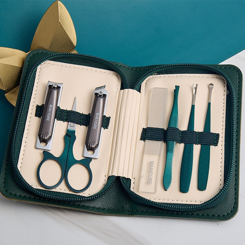 Stainless steel manicure & pedicure tool set - 9 piece kit: includes nail clippers, eyebrow scissors, earwax removal tool, and nail file - wholesale