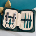 Stainless steel manicure & pedicure tool set - 9 piece kit: includes nail clippers, eyebrow scissors, earwax removal tool, and nail file - wholesale
