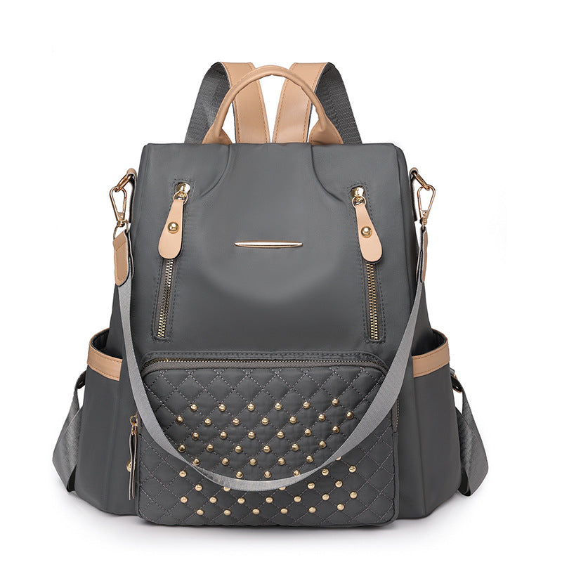 Rhombus student schoolbag large capacity fashion simple casual versatile backpack rivet inlaid women's backpack wholesale