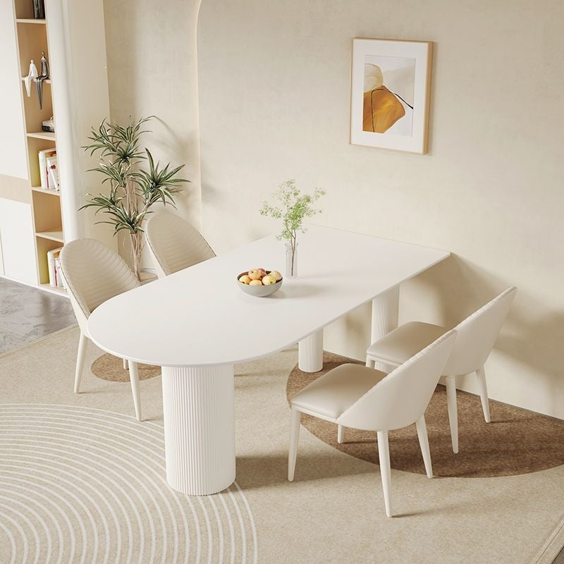 Creamy white rock slab dining table and chair set - modern minimalist semi-circular dining table for small spaces