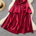 French red camisole dress with padded bust, satin, cinched waist, ruffle trim, sleeveless a-line, elegant party dress