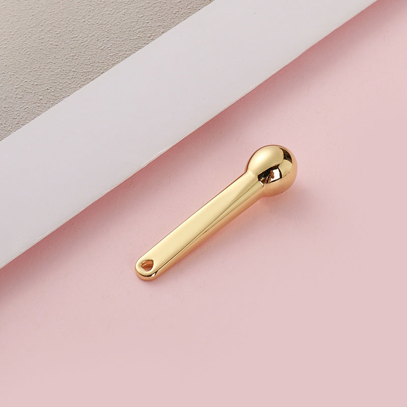Manufacturer's small hammer dispensing stick, exquisite cosmetics digging metal eye cream massage stick, eye beauty stick