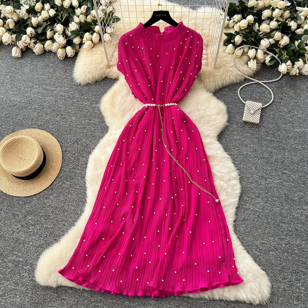 French-inspired v-neck floral chiffon dress with flared sleeves, tie waist, and a figure-flattering, vintage-inspired silhouette