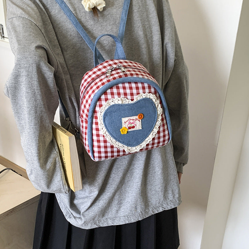 Outer order super fire plaid women's backpack 2025 new spring and summer contrasting color versatile backpack mini schoolbag