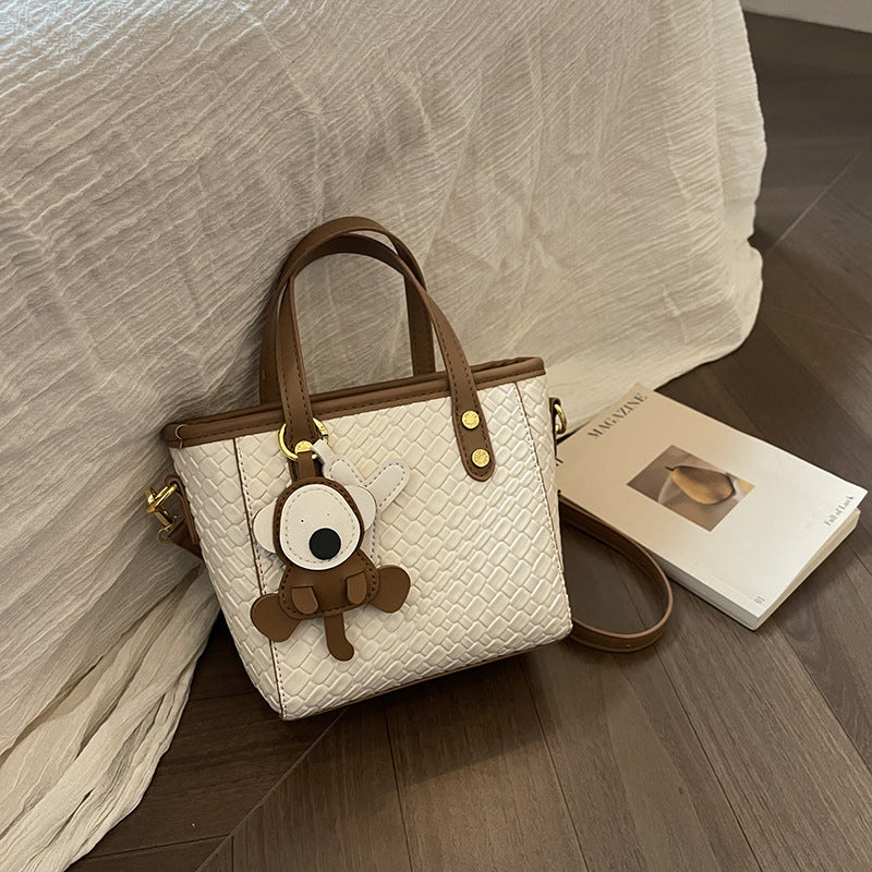 Simple foreign style portable bucket bag women's new fashion woven shoulder messenger bag contrasting color commuter small bag