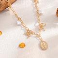 Imitation pearl bow necklace wholesale european and american cross-border portrait relief niche irregular cross clavicle chain for women