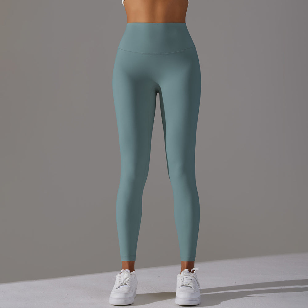 High-waisted, barely-there yoga pants for women, designed with a no-ride-up waistband for a seamless look. these figure-hugging, peach-shaped leggings offer a lift and a comfortable, stretchy fit, perfect for workouts and fitness activities. custom manufa