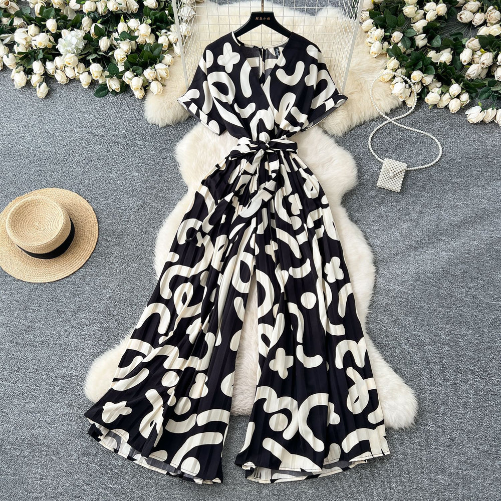 Fashion ins style vacation beach pants women's new style light mature niche stylev neck short sleeve strap looseprinting jumpsuit