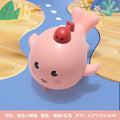 Press the little whale (coral color)