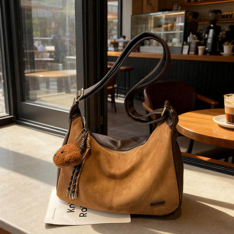 Korean style minimalist suede shoulder bag for women, new autumn 2025 collection, large capacity, fashionable niche design, commuter crossbody bag
